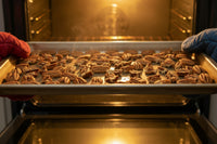 Dry Roasted Pecans, no additives, in a 25lb Box.  Toasted When you order. Pecans.com offers bulk for your wholesale needs.