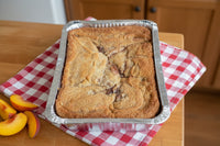Texas peach cobbler by Pecans.com. Hand made right here in Pecans.com's kitchen.  Made to order.
