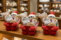 Pecans, praline, and honey butter in a soft penguin box