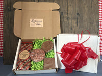 Roasted Salted pecans, pecan patty, pecan praline, and a piece of fudge in a gift box