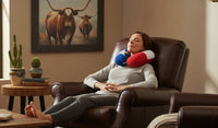 Woman relaxing in a chair with a Texas Flag neck pillow, surrounded by home decor elements. Relax at home, on a plane or in a car.  Great Neck support